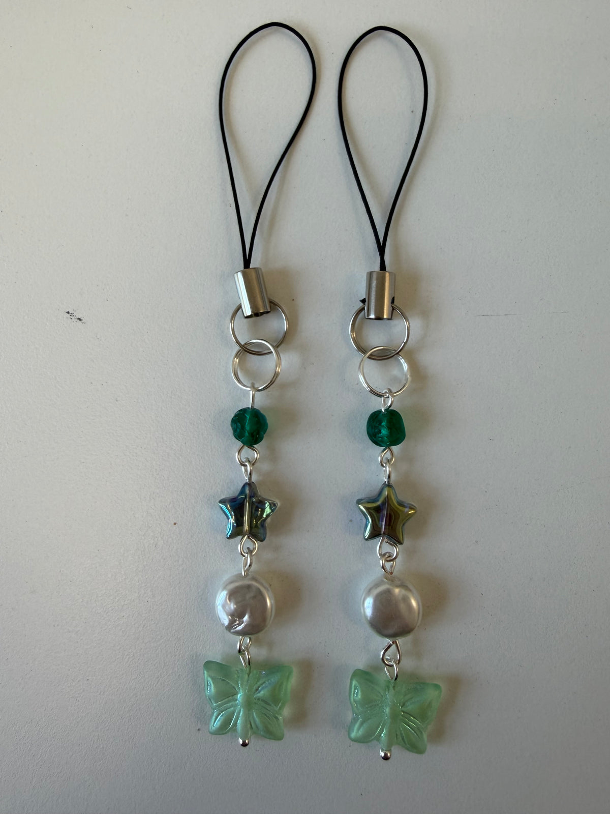 Green butterfly charm